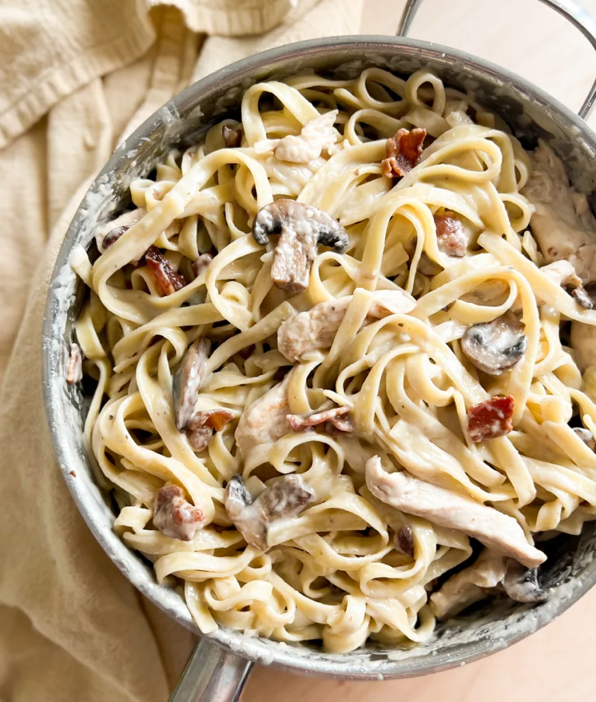 Homemade creamy pasta with bacon and mushrooms