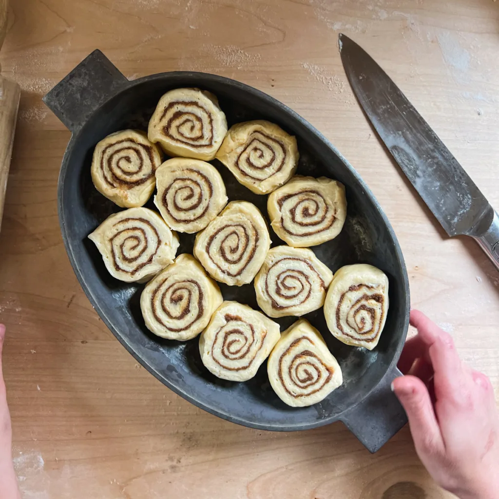 The rolls after having been cut and placed in a pan.