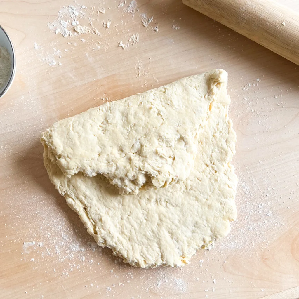 The dough after one half has been folded into the center.