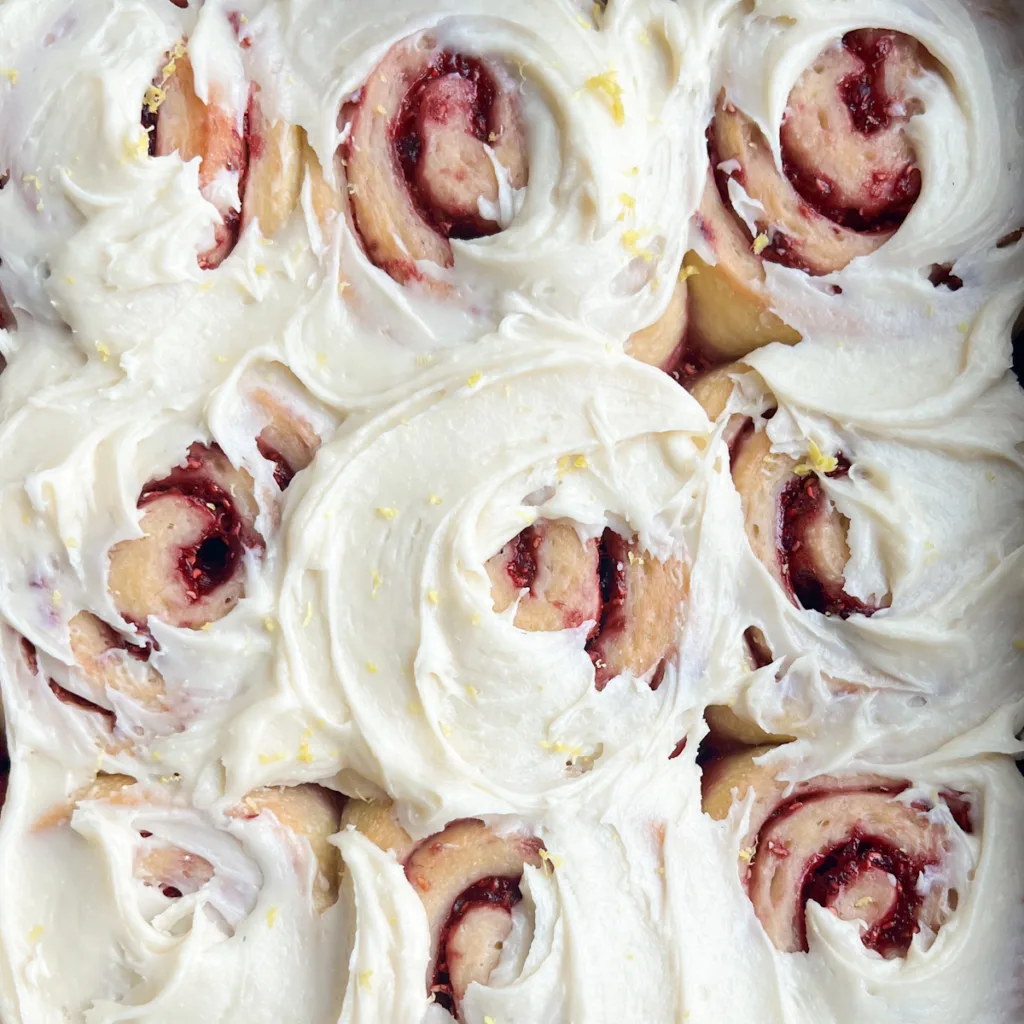 frosted sourdough raspberry lemon rolls