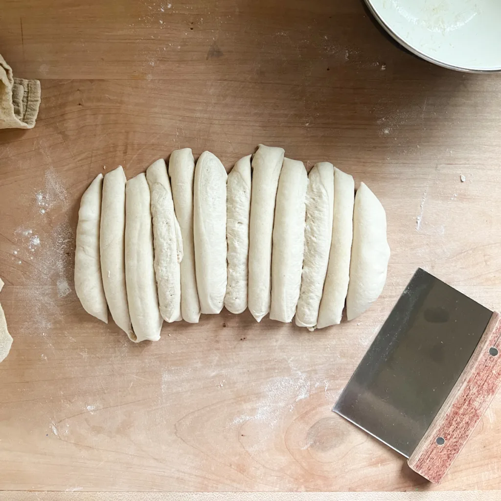 garlic knot dough that has been divided into 12 pieces