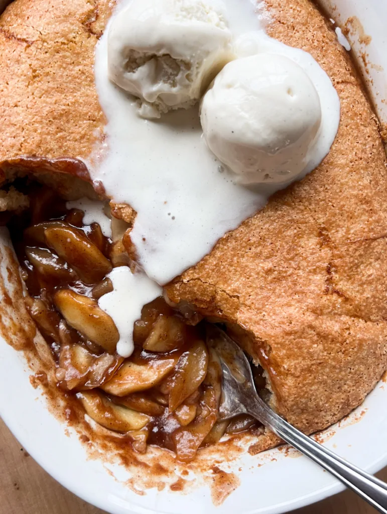 sourdough apple cobbler topped with ice cream.