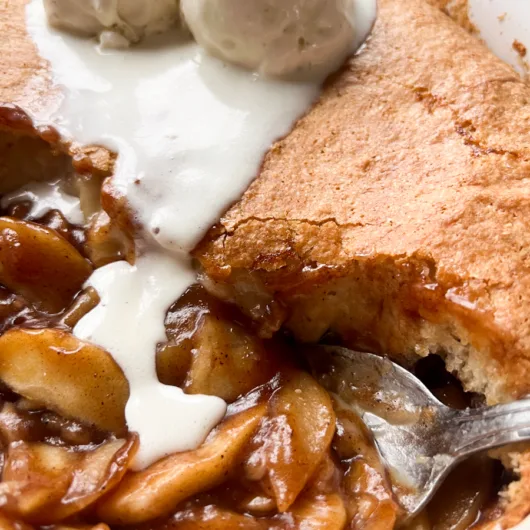 sourdough apple cobbler topped with ice cream.