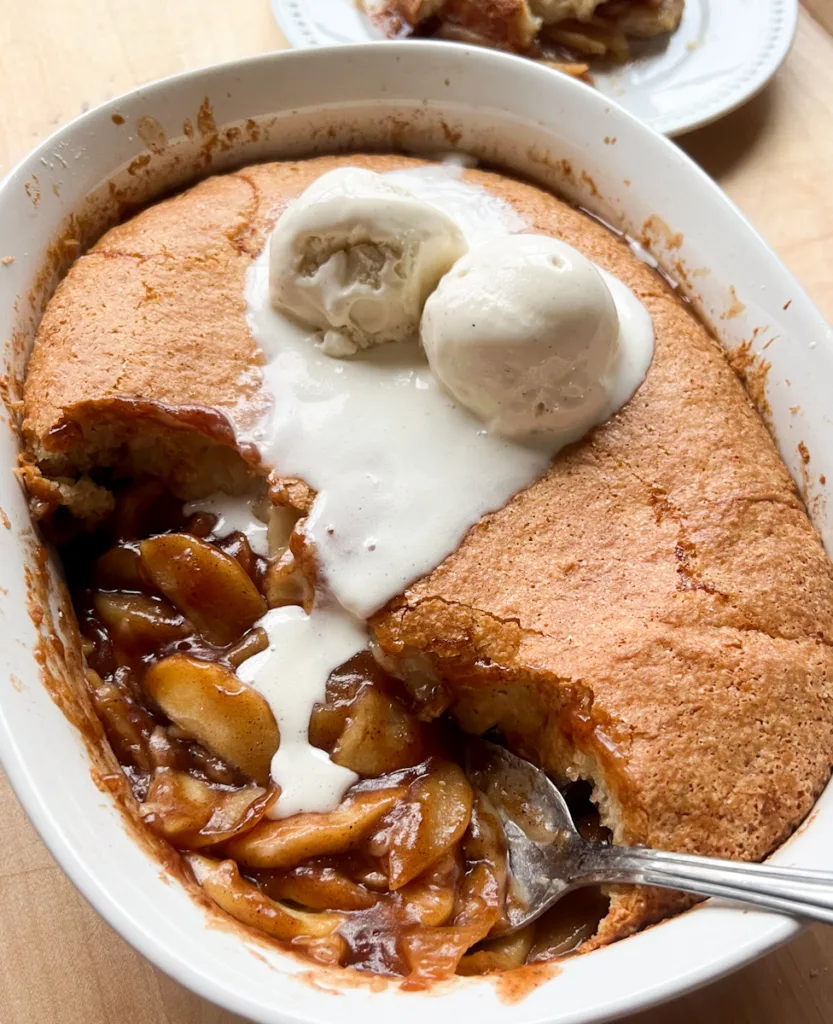 sourdough apple cobbler topped with ice cream.