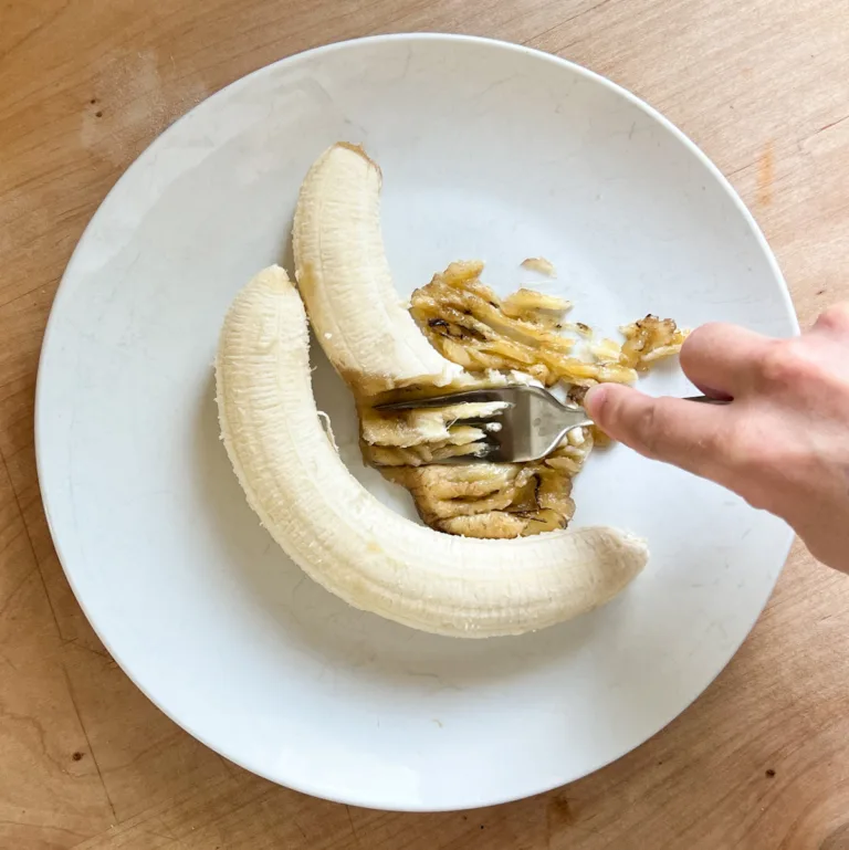 mashing bananas on a plate