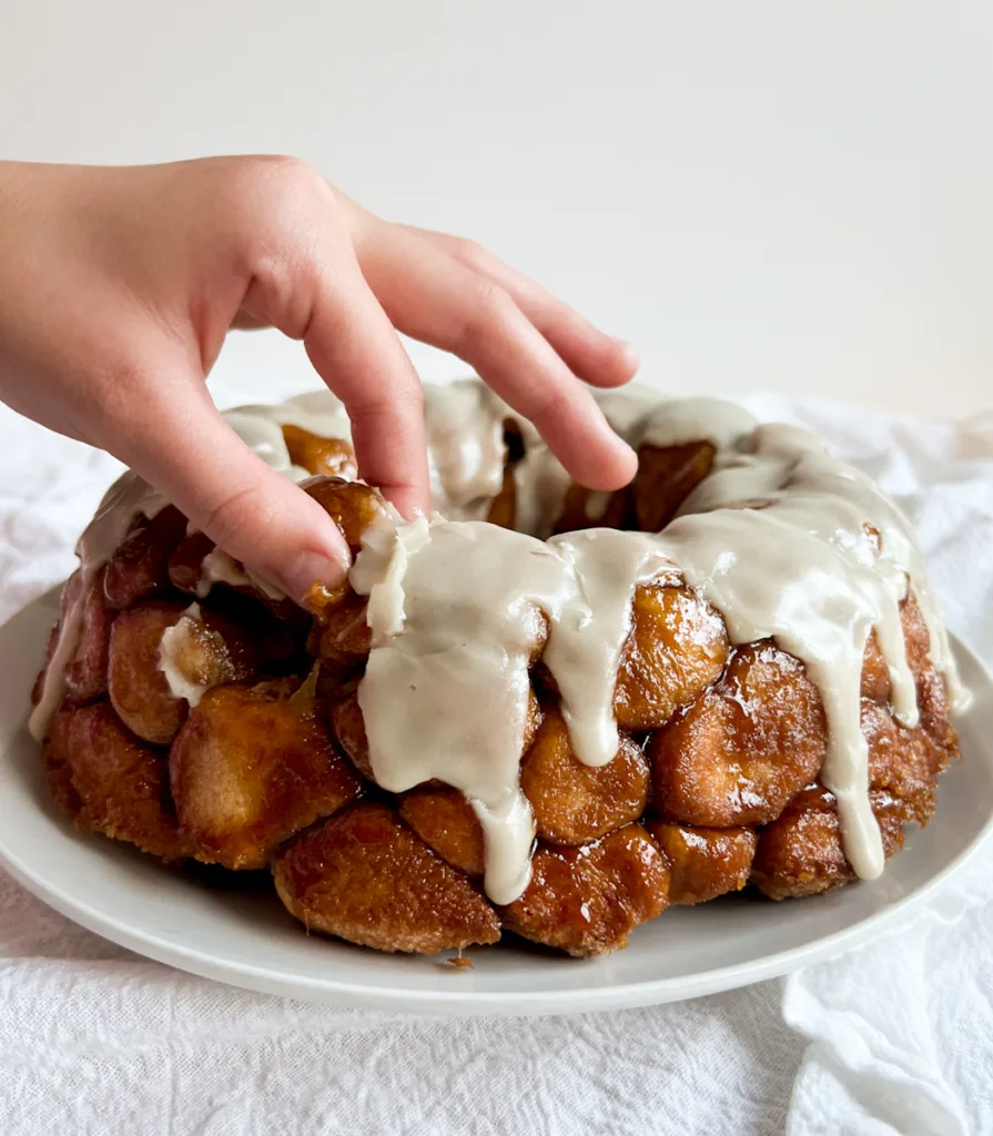 Pulling out a piece of monkey bread