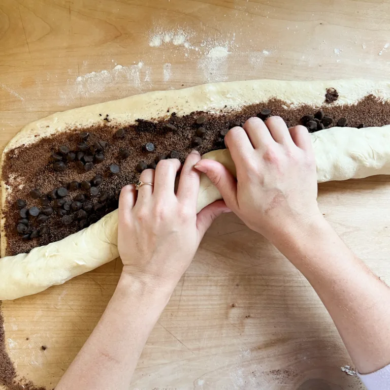 rolling up sourdough chocolate rolls