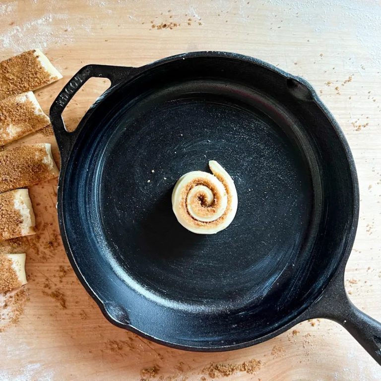 The first roll setting in the center of a cast iron pan.