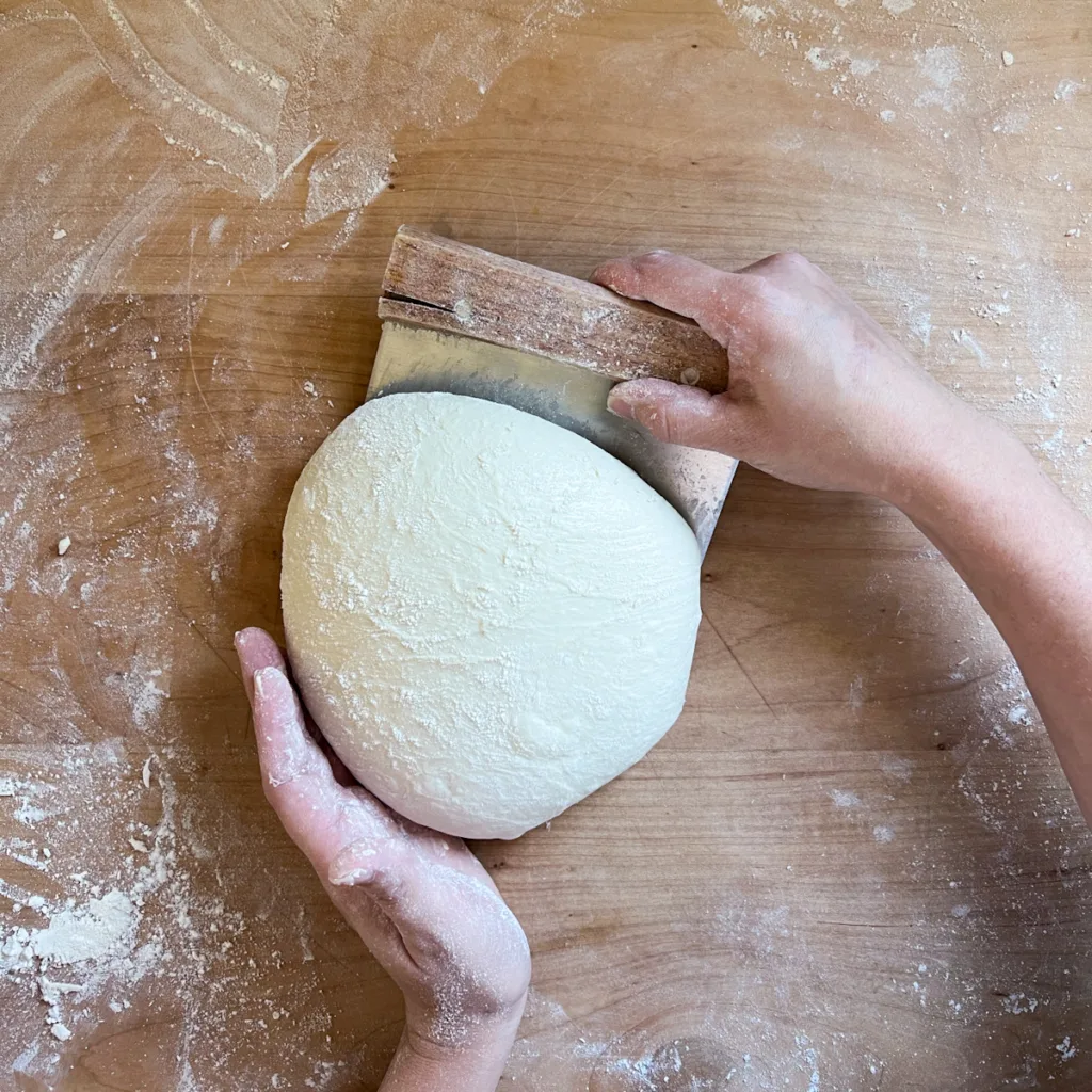 Shaping sourdough.