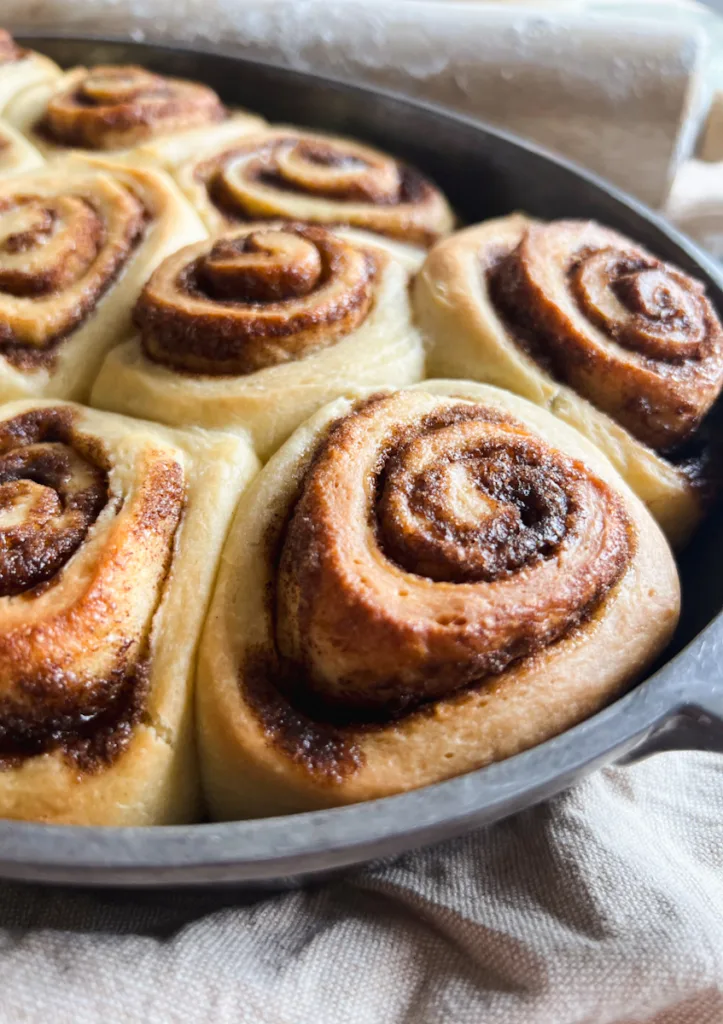 A close-up of the sourdough cinnamon rolls in the pan before they have been frosted.