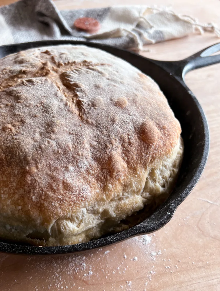 Sourdough country skillet bread in a cast iron skillet.