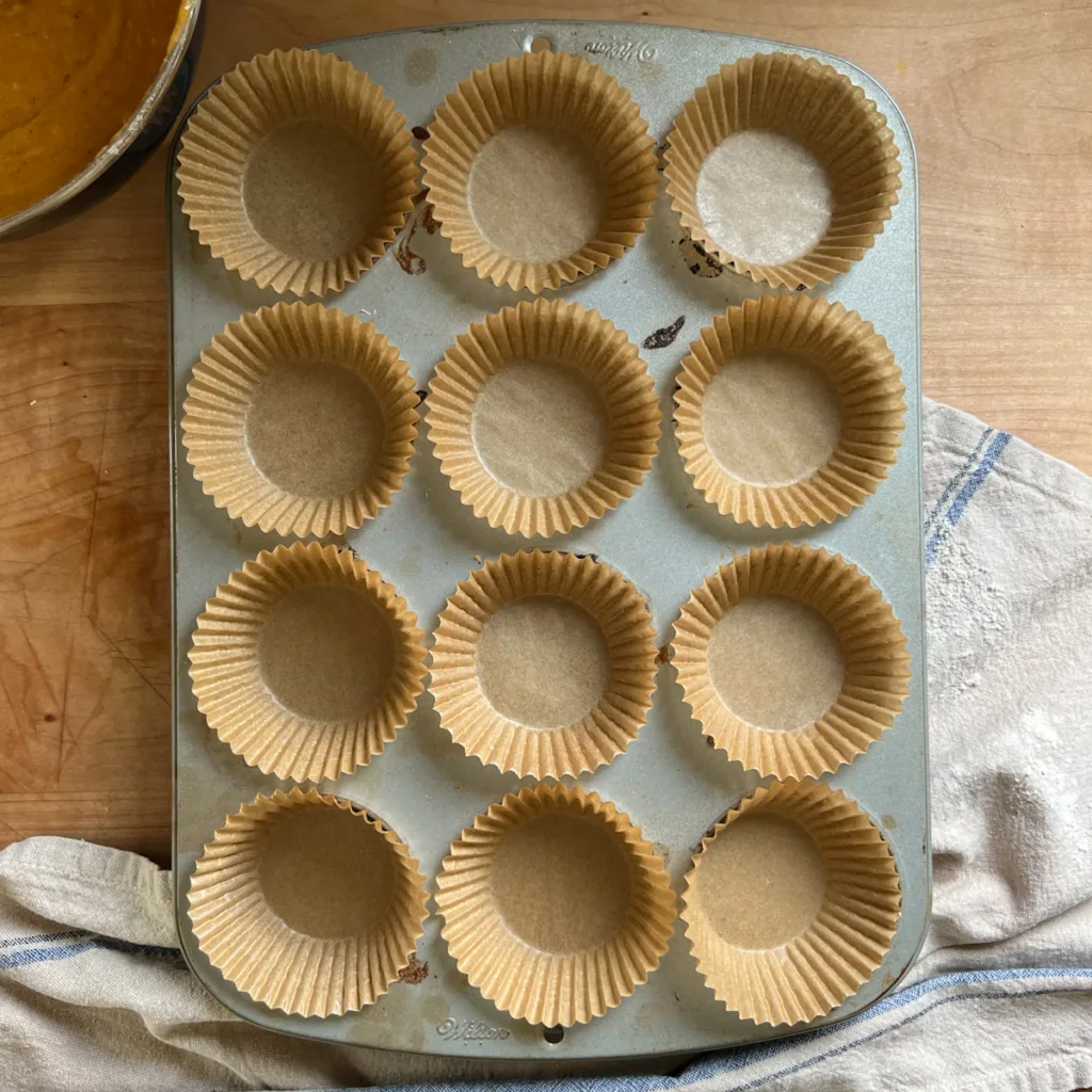 A tray with empty muffin cups.