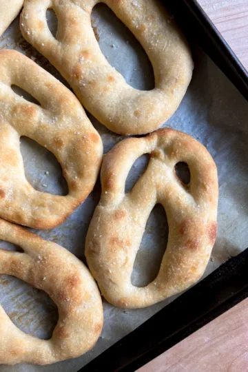 Sourdough fougasse that has been shaped like ghosts.