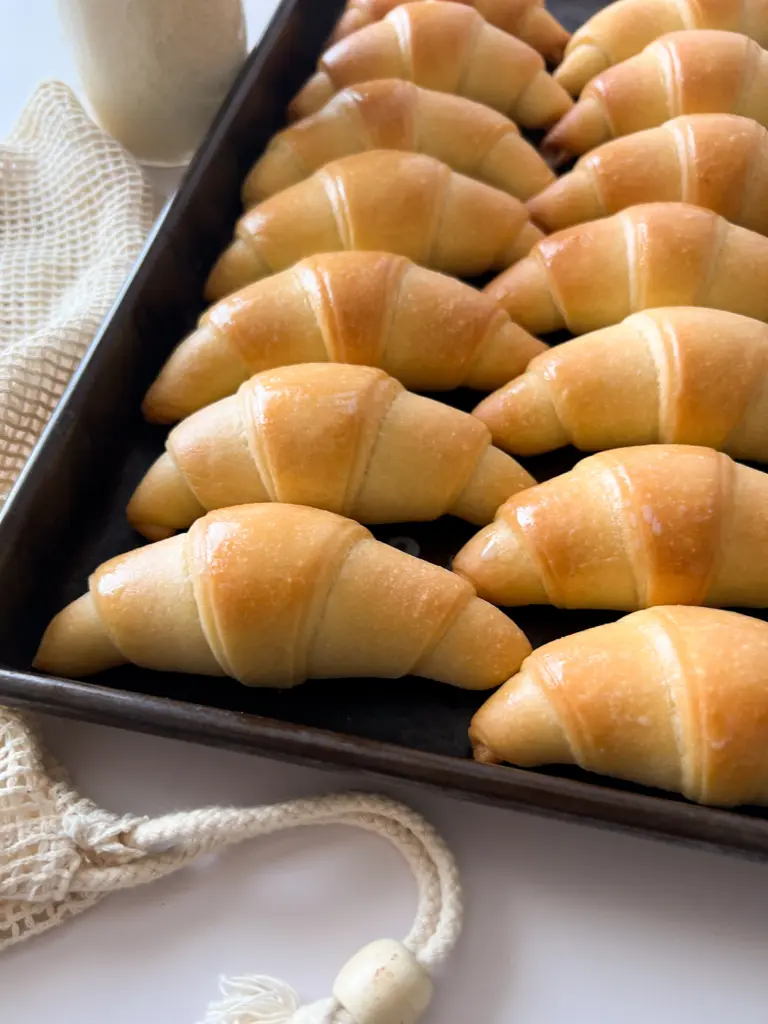Crescent rolls on a baking sheet.