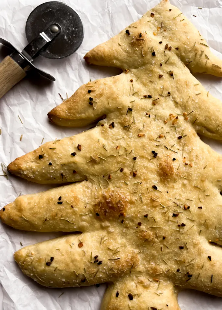 Christmas tree fougasse on parchment paper.