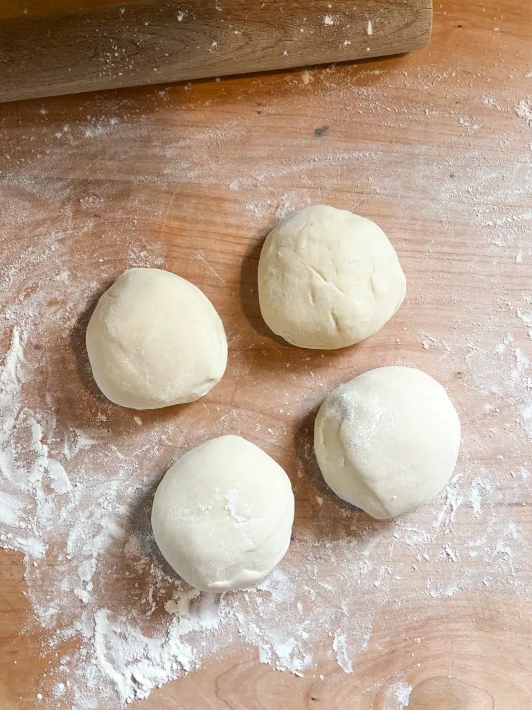The dough portions shaped into balls. 