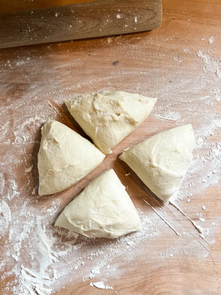 the star bread dough divided into 4 portions.