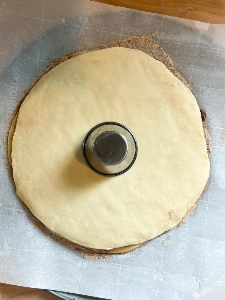 The dough with a cup in the center.