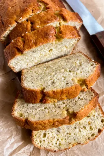 A loaf of banana bread that has been cut into slices.