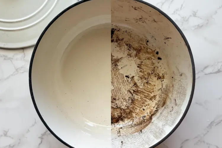 Enamel Dutch oven showing before and after cleaning - one side with burnt-on stains, the other side white and spotless after being cleaned with a Magic Eraser.